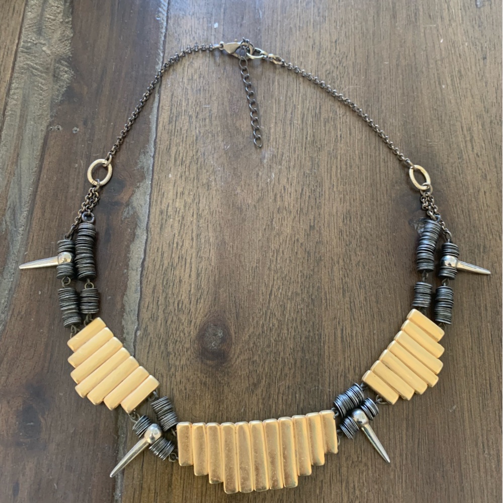 Gold statement necklace with plate and spike details